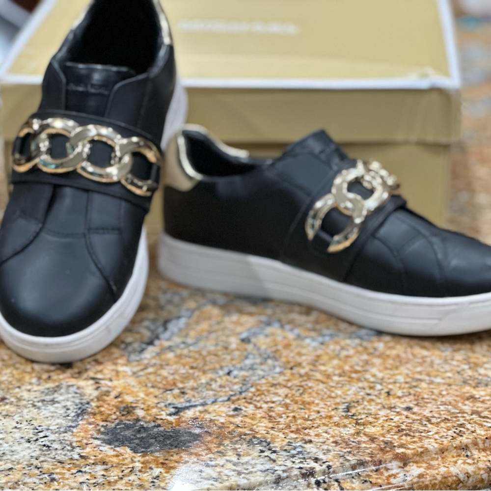 BRAND NEW Michael Kors Leather slip on sneakers.